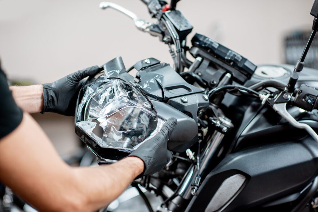 removing broken headlight after the accident